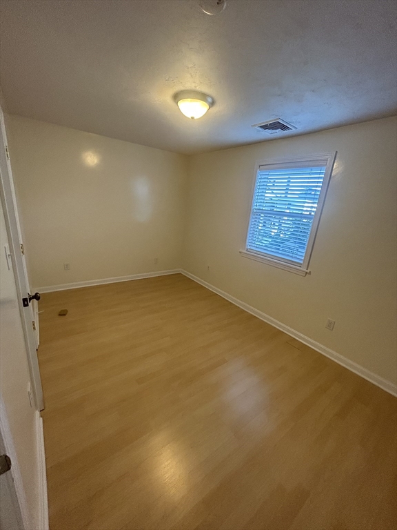 36 Hunting Street, Unit 2 Cambridge, MA 02141 - Photo 9 of 19 an empty room with windows