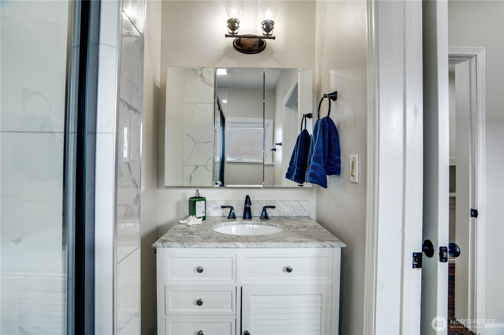 911 Hunt Avenue Sumner, WA 98390 - Photo 12 of 29 a bathroom with a sink and a mirror