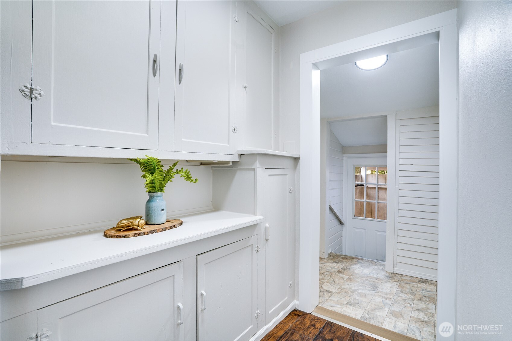 911 Hunt Avenue Sumner, WA 98390 - Photo 13 of 29 a kitchen with white cabinets and appliances