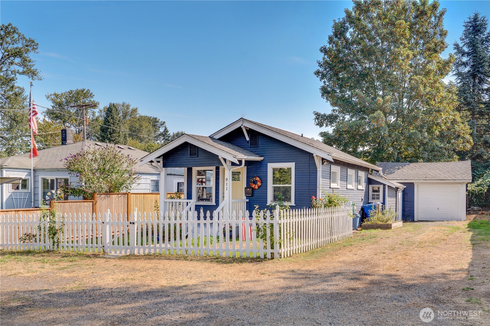 911 Hunt Avenue Sumner, WA 98390 - Photo 2 of 29 a front view of a house with a patio