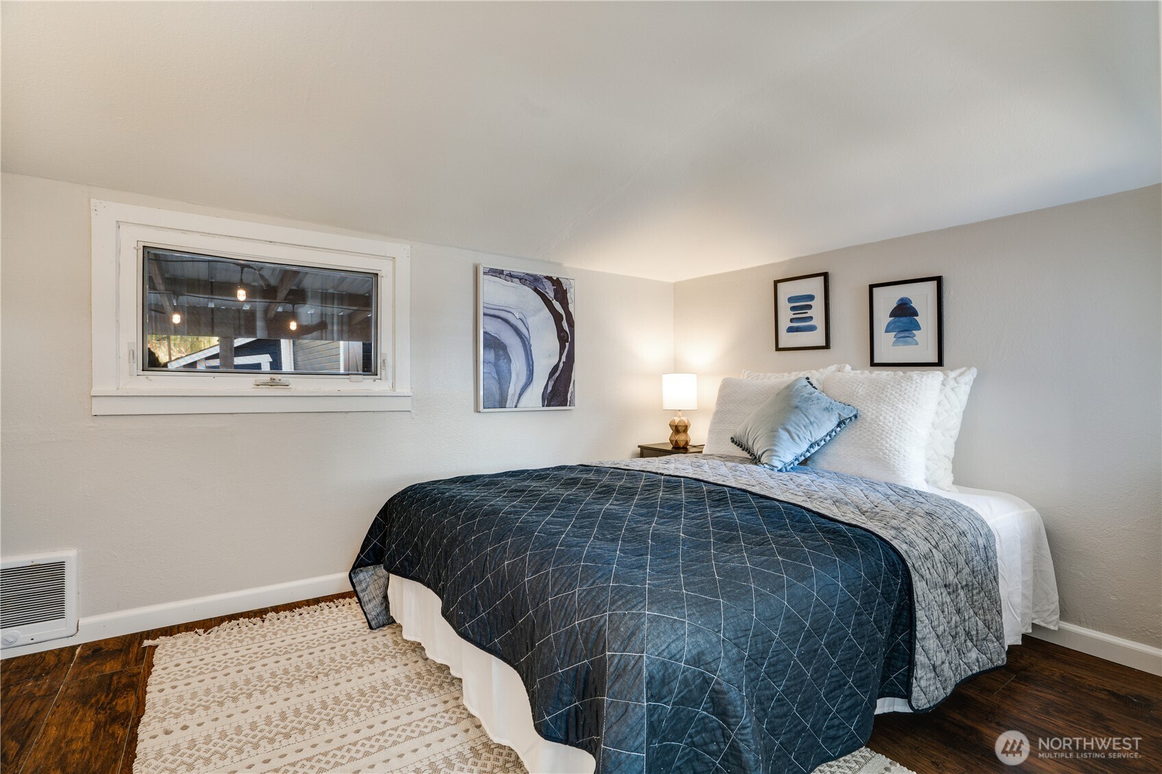 911 Hunt Avenue Sumner, WA 98390 - Photo 9 of 29 a bedroom with a bed and painting on the wall