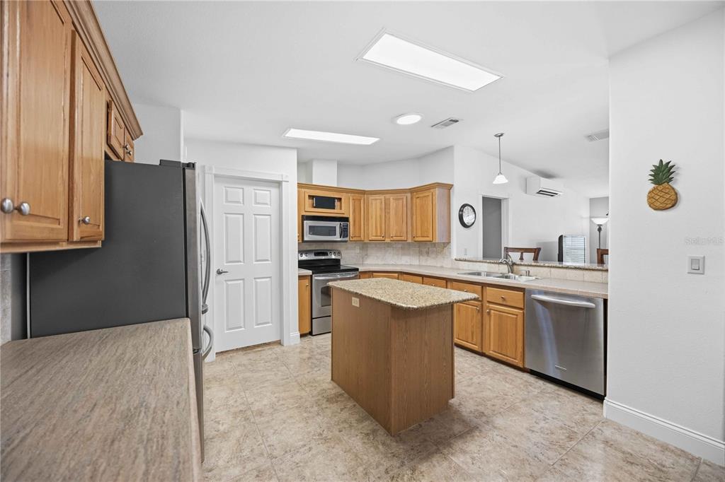 18 Emden Circle Punta Gorda, FL 33950 - Photo 22 of 61 a large kitchen with cabinets and stainless steel appliances