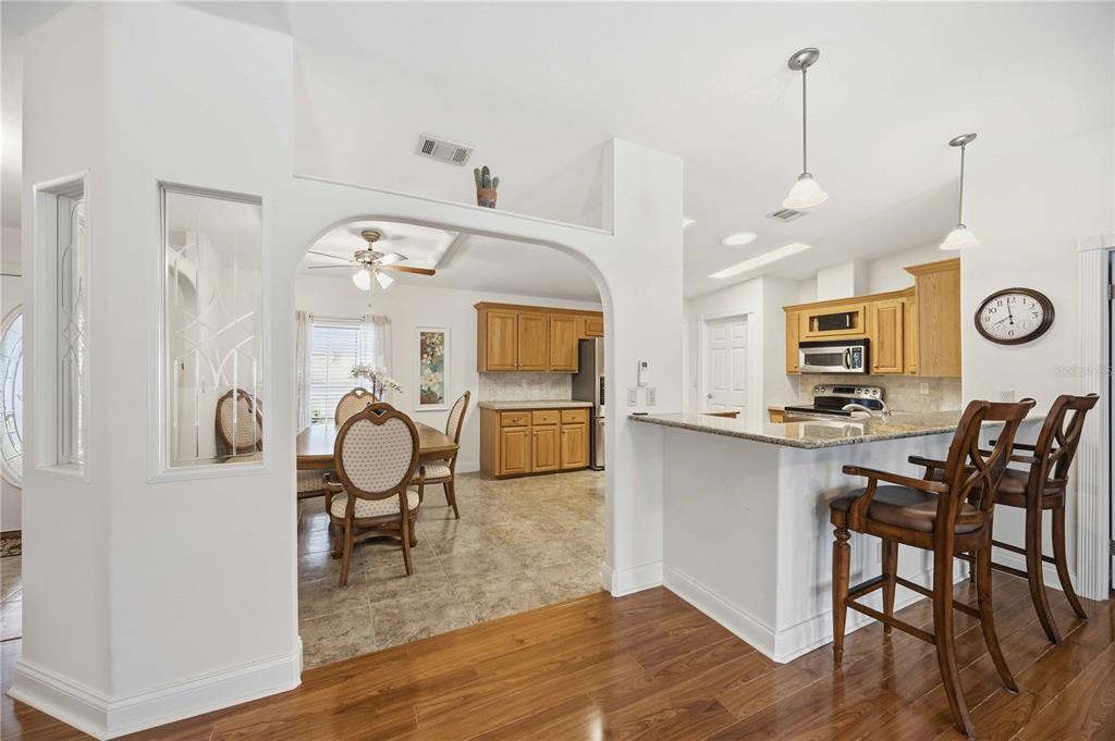 18 Emden Circle Punta Gorda, FL 33950 - Photo 23 of 61 a view of a kitchen and dining area with wooden floor