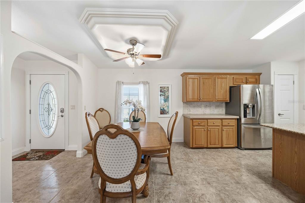 18 Emden Circle Punta Gorda, FL 33950 - Photo 24 of 61 a view of a kitchen with a sink and dishwasher a refrigerator with white cabinets