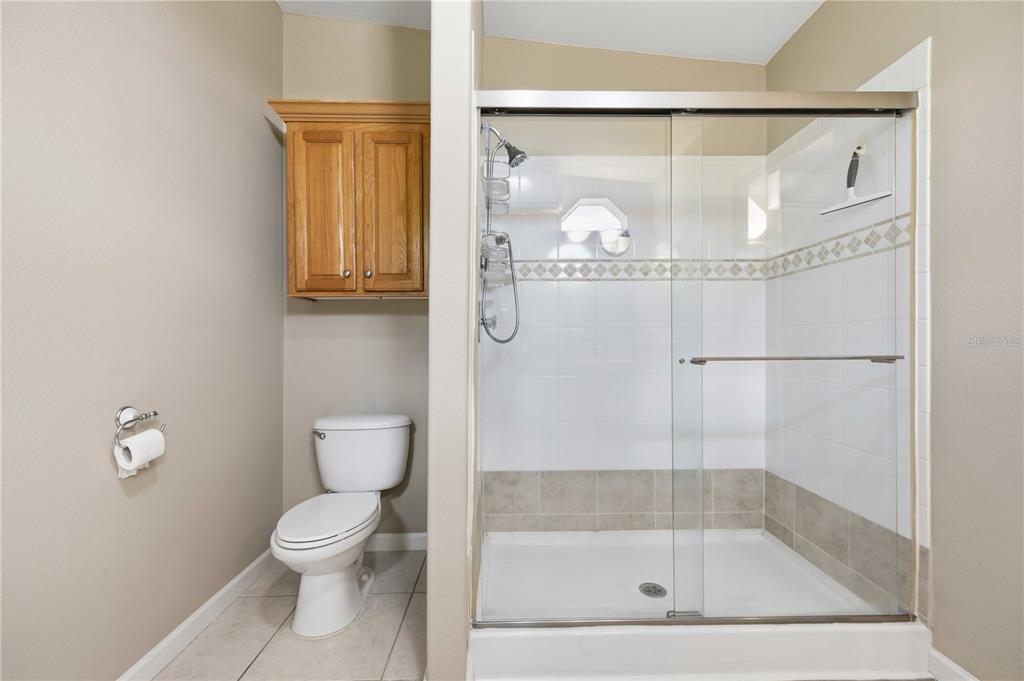 18 Emden Circle Punta Gorda, FL 33950 - Photo 33 of 61 a bathroom with a glass shower door