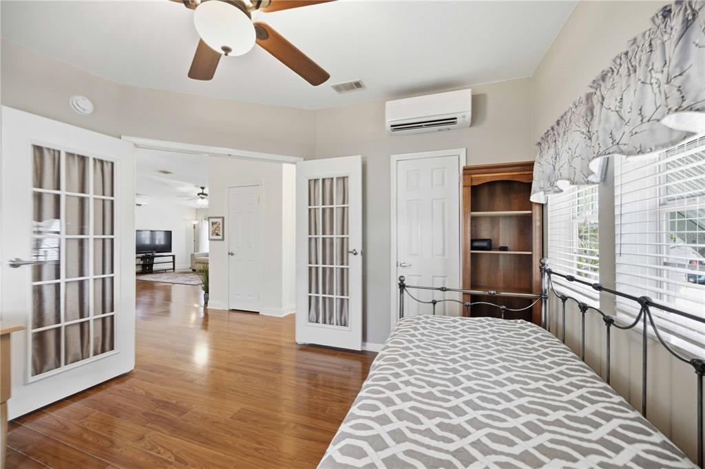 18 Emden Circle Punta Gorda, FL 33950 - Photo 35 of 61 a hallway with wooden floor windows and a chandelier