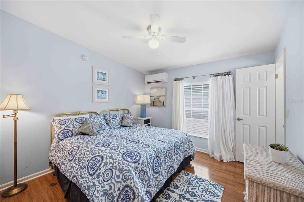 18 Emden Circle Punta Gorda, FL 33950 - Photo 39 of 61 a bedroom with a large bed and a chandelier
