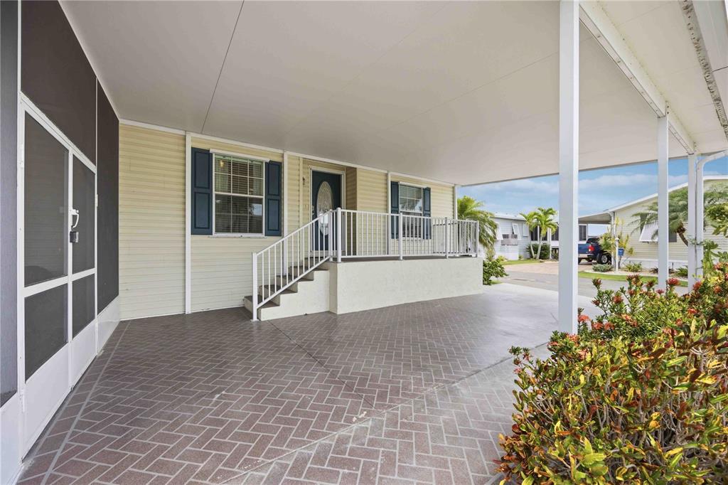 18 Emden Circle Punta Gorda, FL 33950 - Photo 8 of 61 a view of a porch with a table and chairs and potted plants