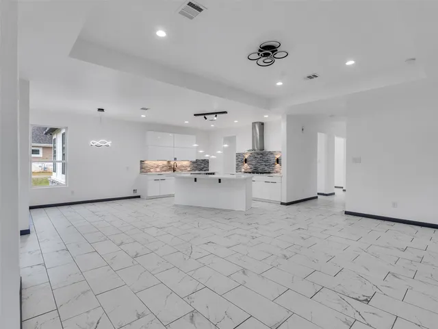 a view of a room that has a washer and dryer