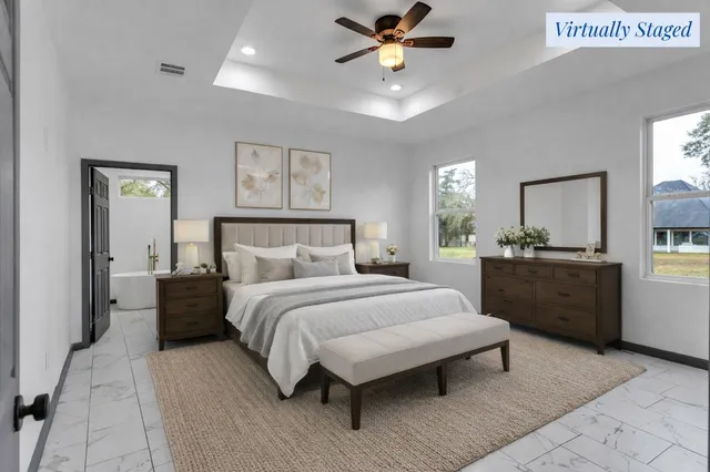 a view of a workspace with furniture and wooden floor