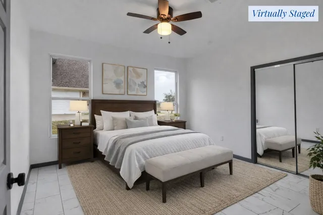 an aerial view of a house with a yard basket ball court and outdoor seating