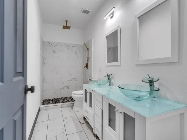 an aerial view of residential houses with outdoor space