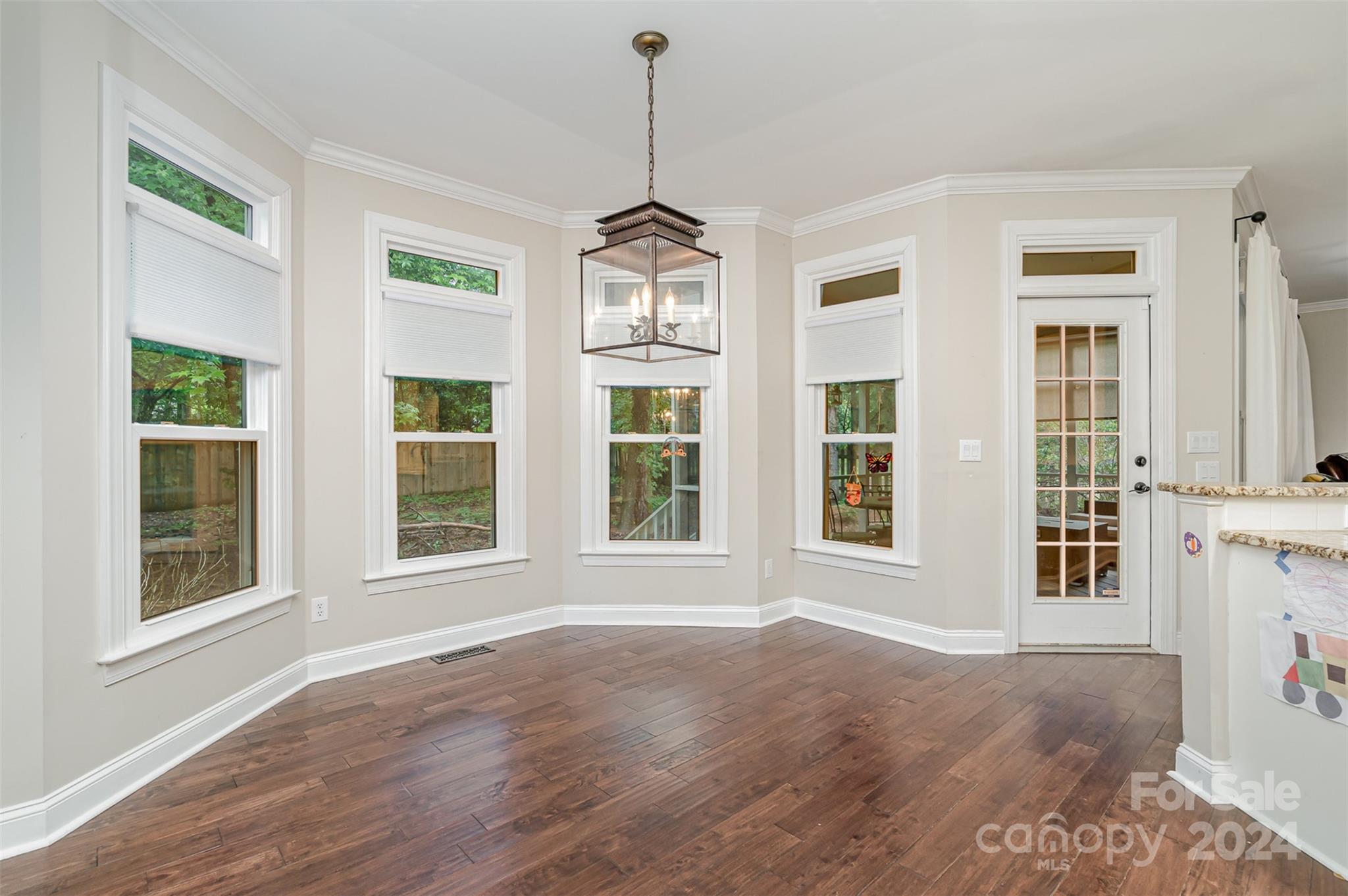 3410 Rhett Butler Place Charlotte, NC 28270 - Photo 11 of 31 a view of an empty room with a window and wooden floor