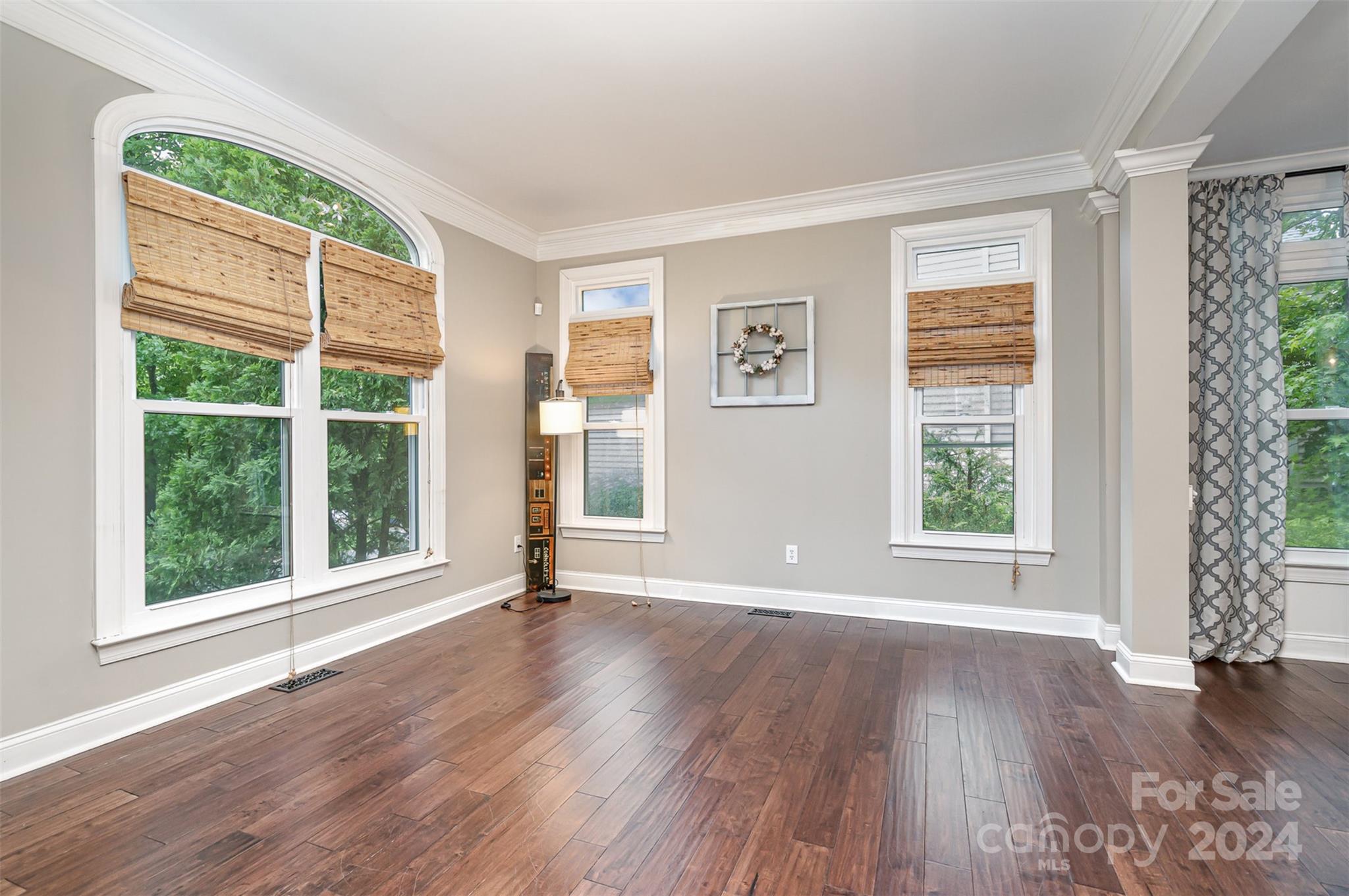 3410 Rhett Butler Place Charlotte, NC 28270 - Photo 3 of 31 a view of an empty room with wooden floor and a window