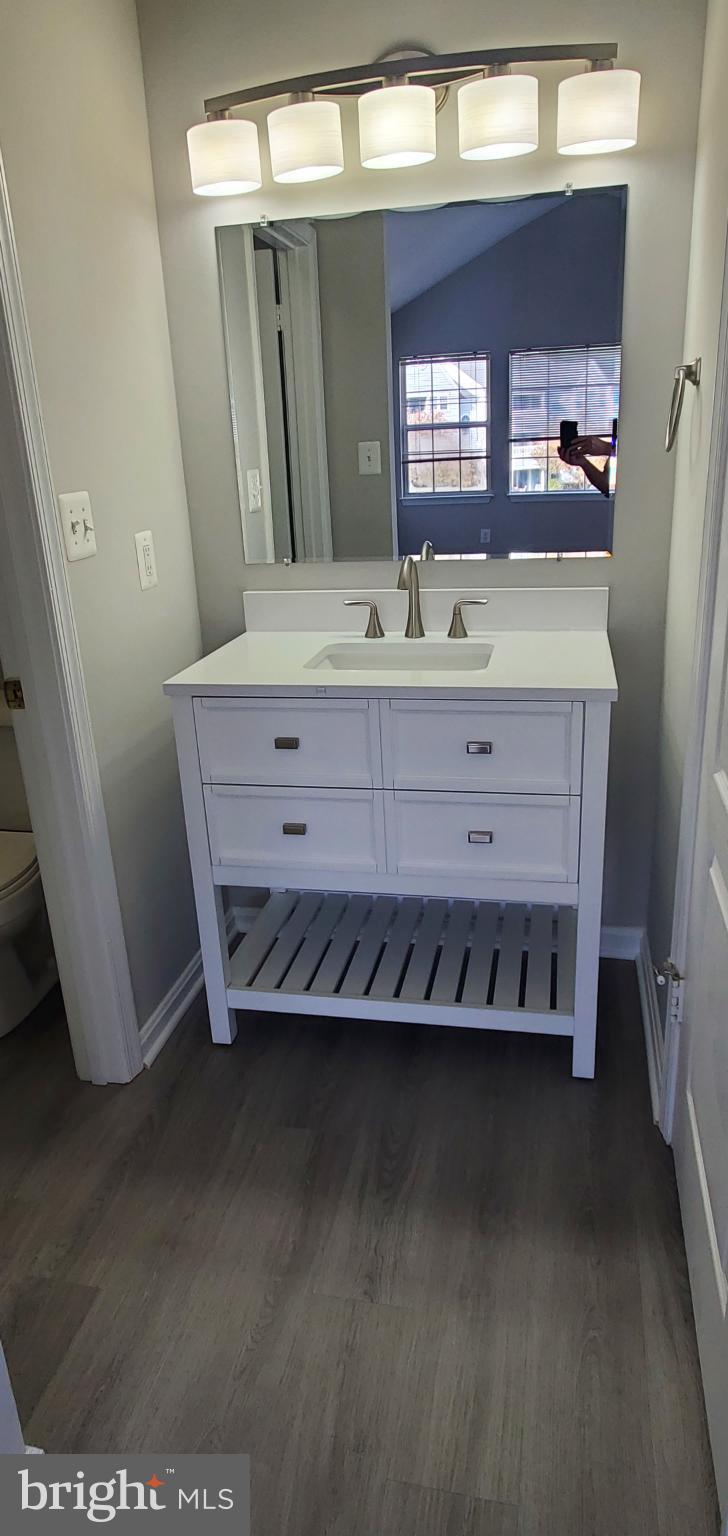 8343 Montgomery Run Road Ellicott City, MD 21043 - Photo 7 of 36 Sleek modern bathroom with elegant fixtures.