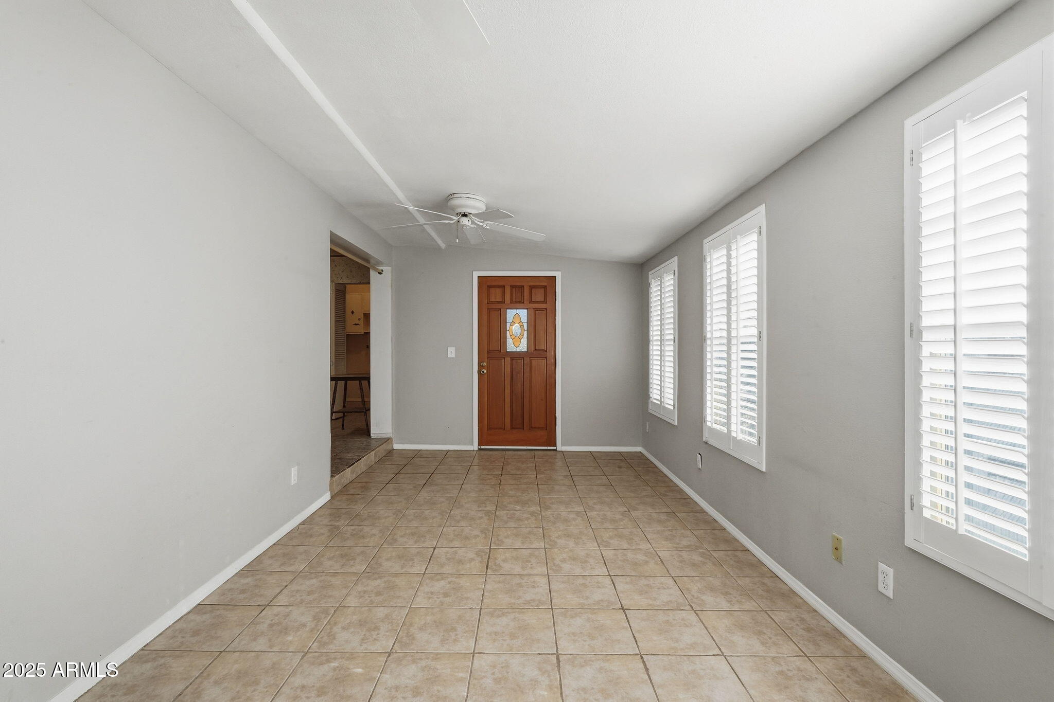 1208 North Palm Ln Circle Coolidge, AZ 85128 - Photo 11 of 33 an empty room with windows