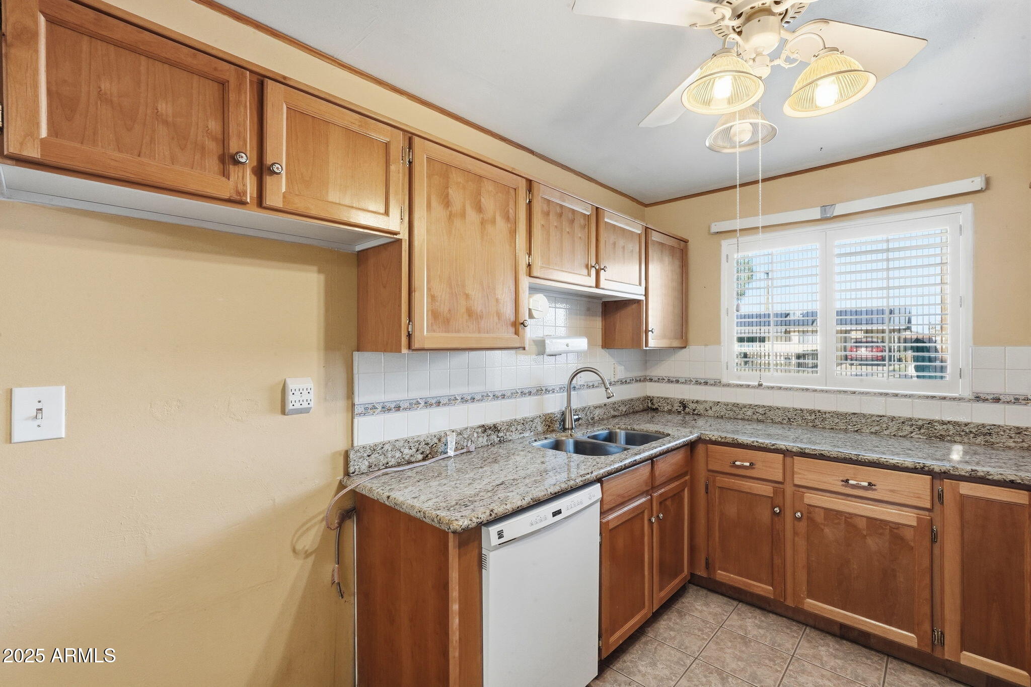 1208 North Palm Ln Circle Coolidge, AZ 85128 - Photo 14 of 33 a kitchen with a sink cabinets and window