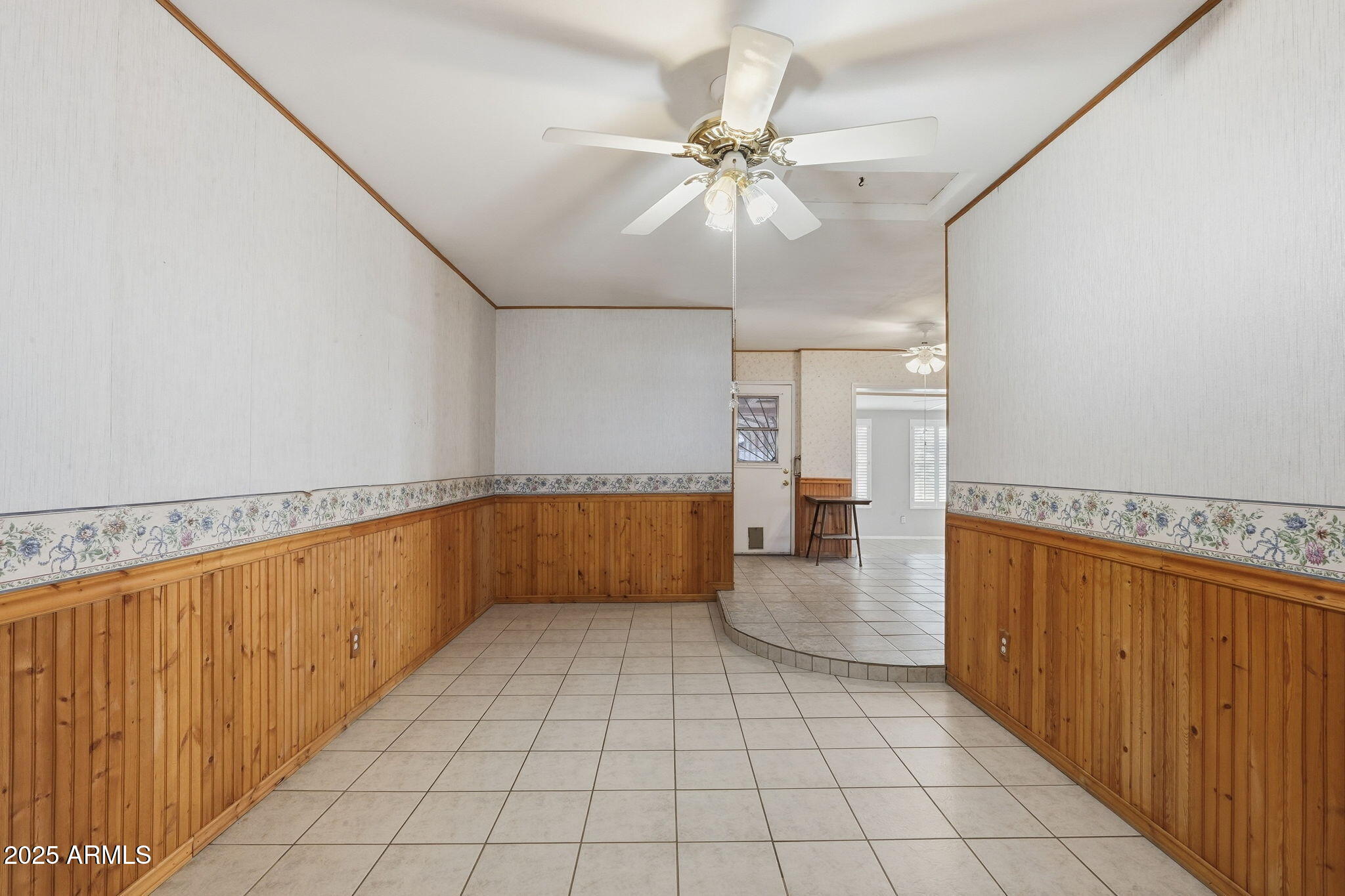 1208 North Palm Ln Circle Coolidge, AZ 85128 - Photo 18 of 33 a view of a hallway with a chandelier