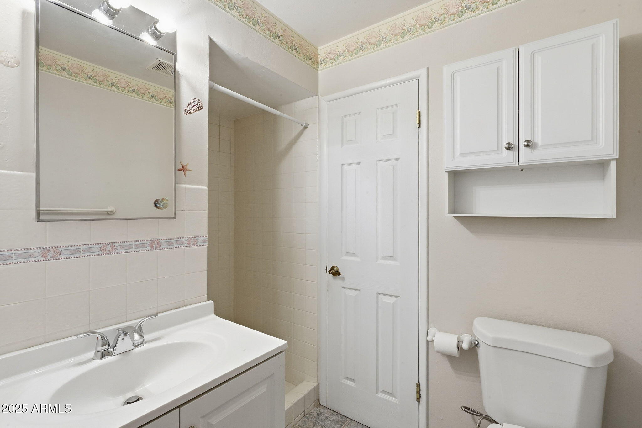 1208 North Palm Ln Circle Coolidge, AZ 85128 - Photo 25 of 33 a bathroom with a sink toilet and vanity