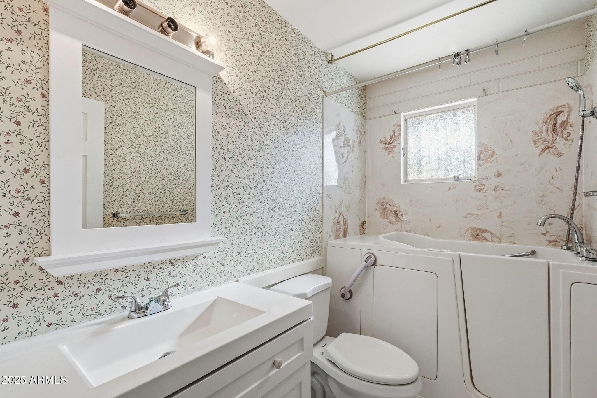 1208 North Palm Ln Circle Coolidge, AZ 85128 - Photo 26 of 33 a bathroom with a sink toilet and mirror
