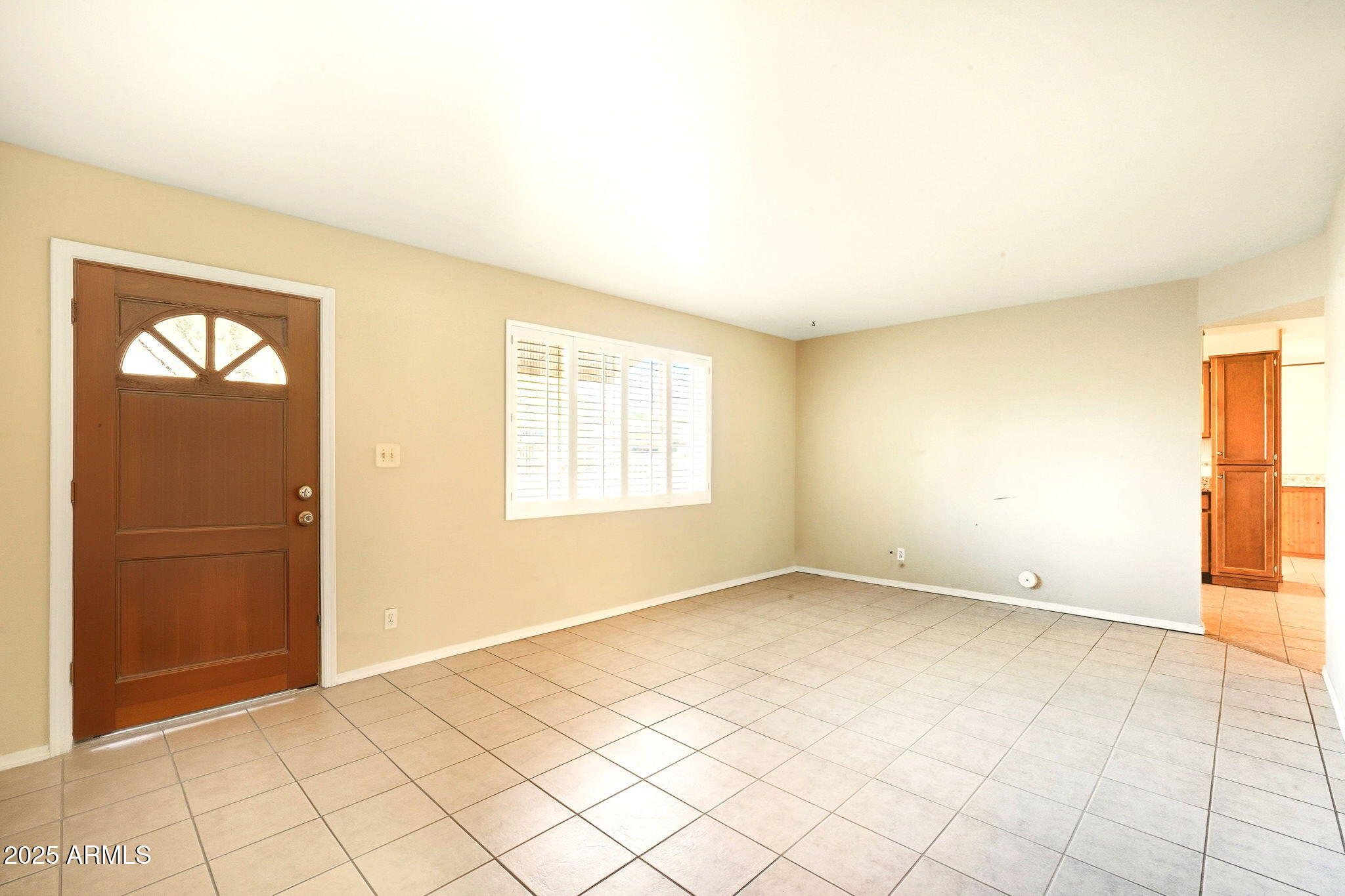 1208 North Palm Ln Circle Coolidge, AZ 85128 - Photo 7 of 33 an empty room with windows