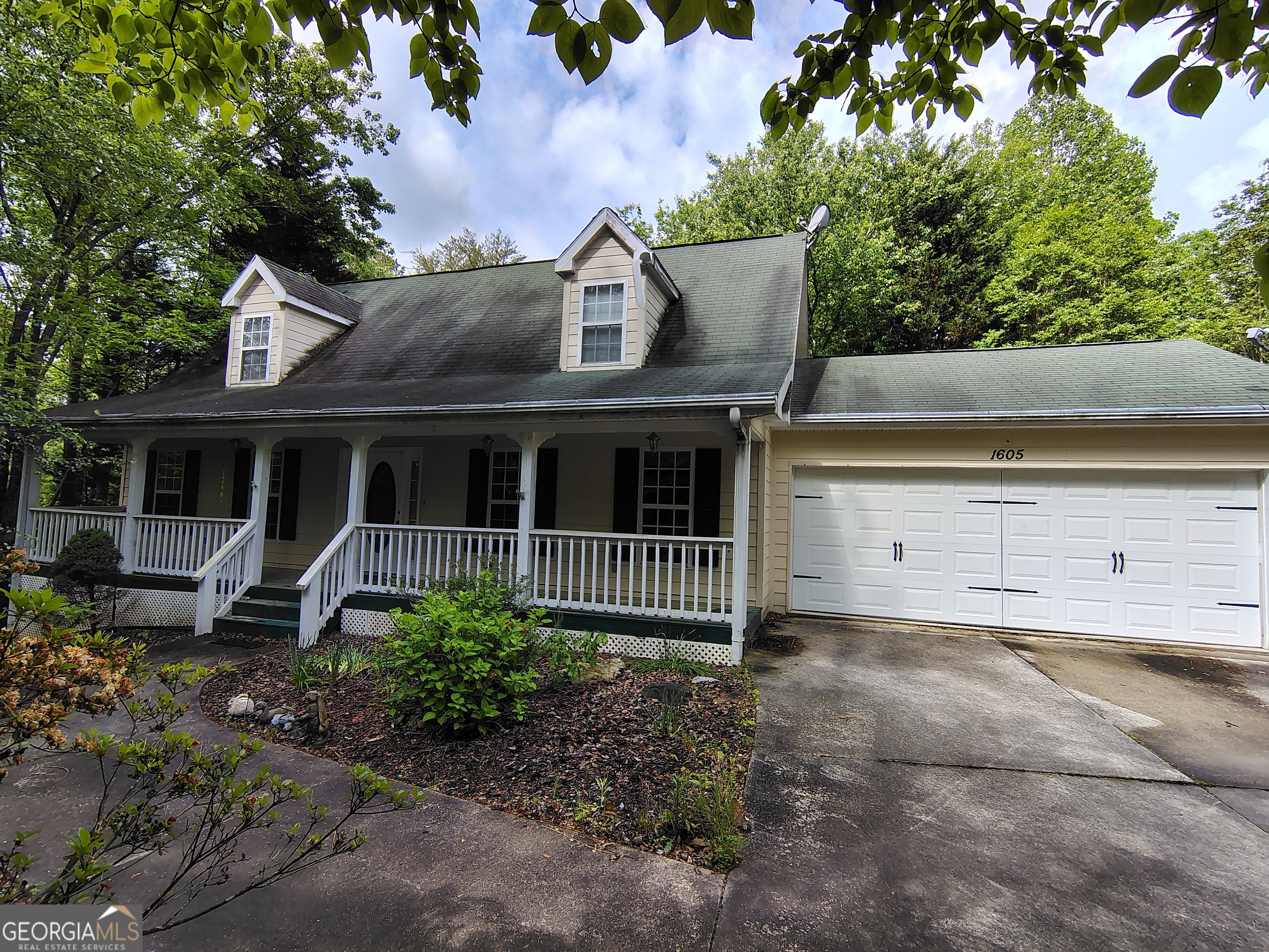 1605 Preacher Campbell Road Clarkesville, GA 30523 - Photo 1 of 1 front view of a house with a garden