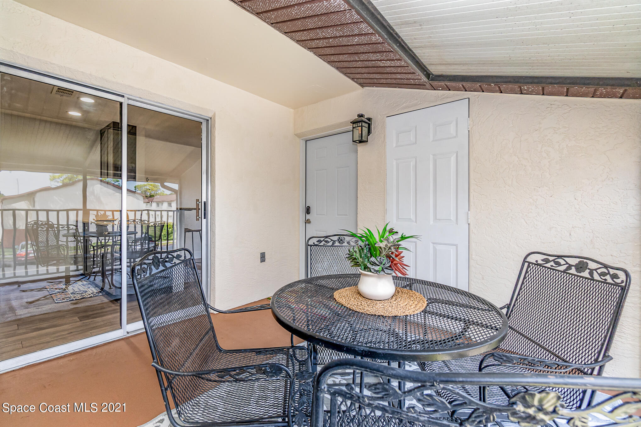 663 Ridge Club Drive, Unit 32 Melbourne, FL 32934 - Photo 3 of 23 Screened Porch & front door