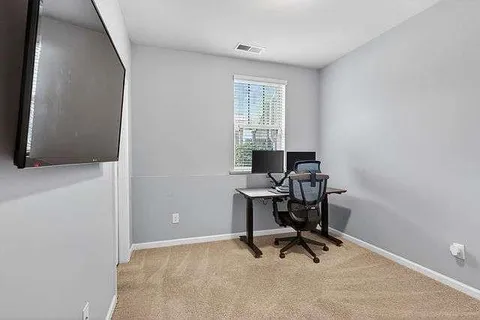 a workspace with furniture and a window