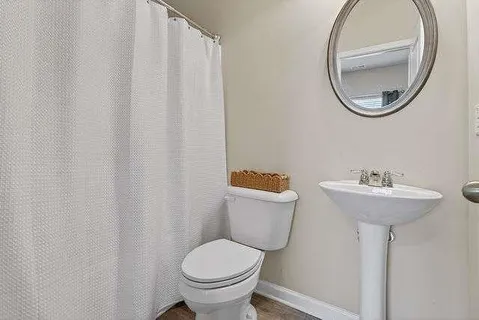 a bathroom with a sink and toilet