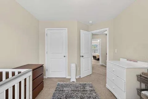 a view of a hallway with washer and dryer