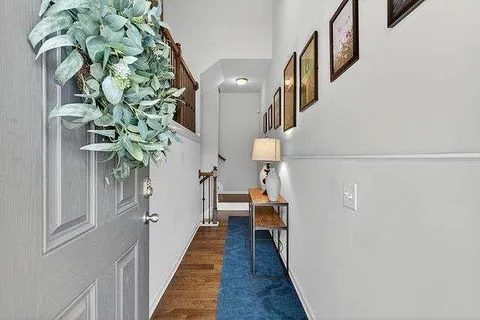a view of entryway with wooden floor