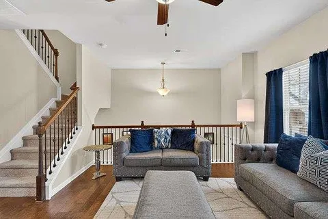 a living room with furniture and a window