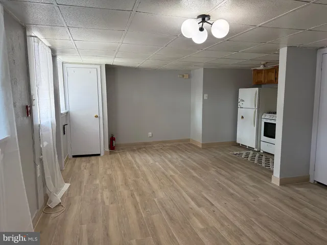 a view of an empty room with a bathroom