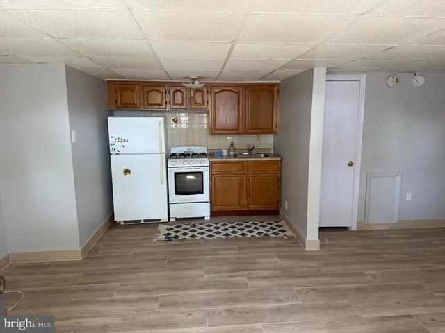 a kitchen with stainless steel appliances granite countertop a stove a refrigerator and a microwave