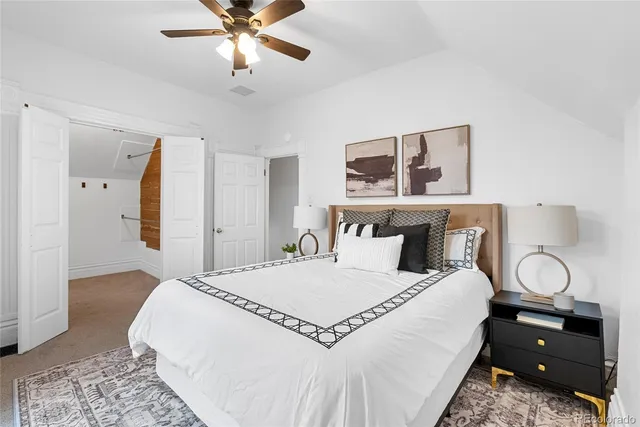 a bedroom with a bed and window