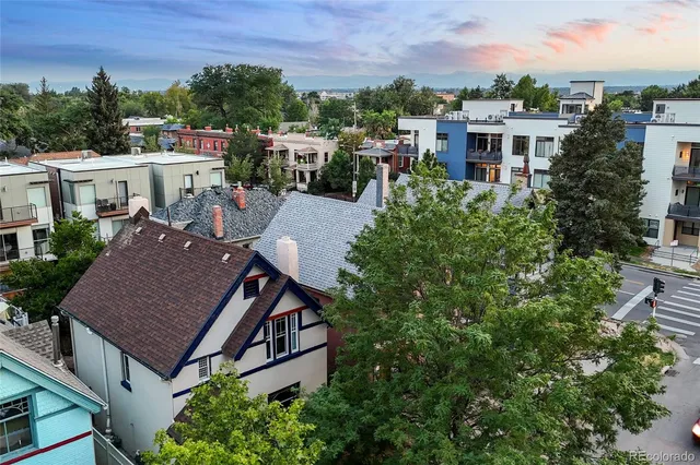 aerial view of a house with a yard and balcony