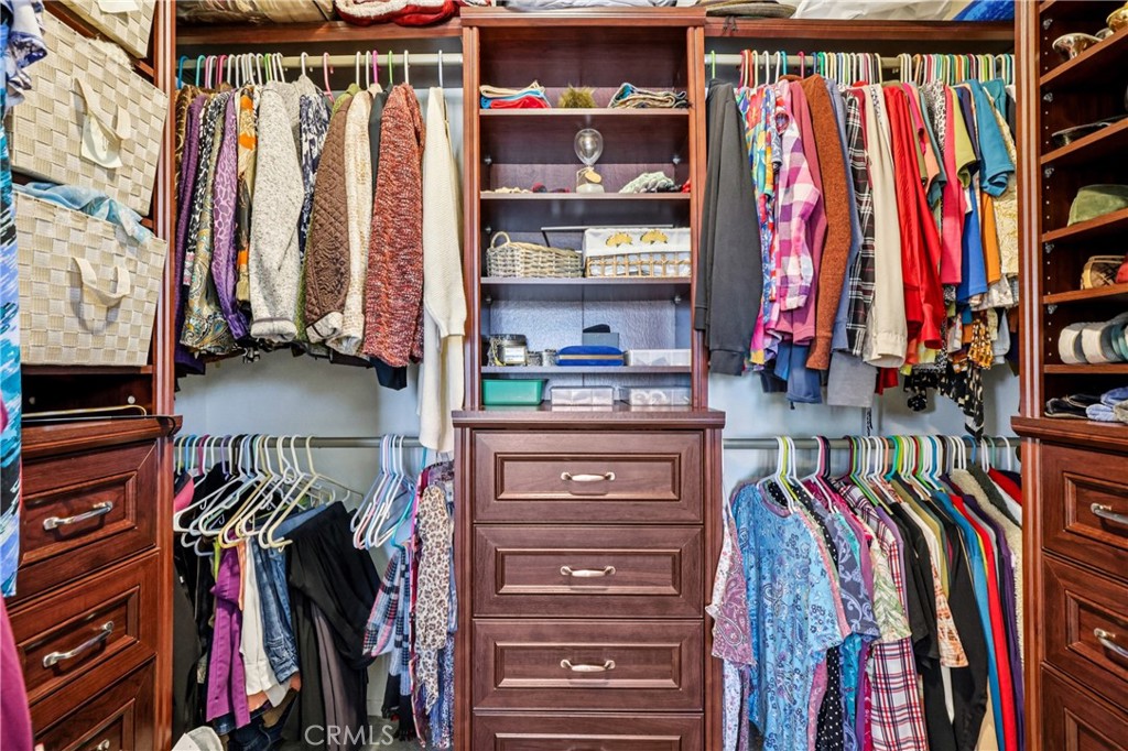 13541 Dean Street Tustin, CA 92780 - Photo 13 of 30 a view of walk in closet with clothes and shoes