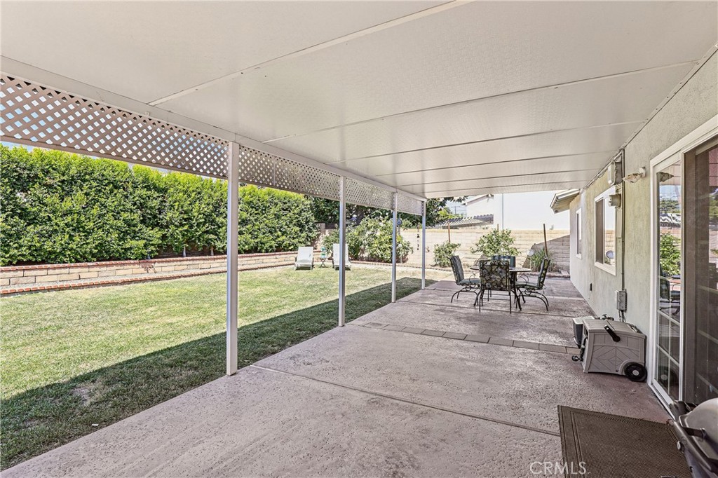 13541 Dean Street Tustin, CA 92780 - Photo 21 of 30 a view of a porch with chairs and backyard
