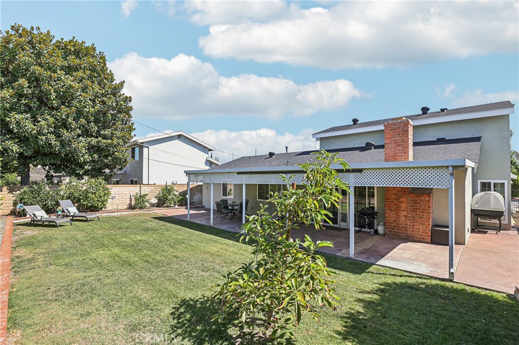 13541 Dean Street Tustin, CA 92780 - Photo 22 of 30 front view of a house with a yard
