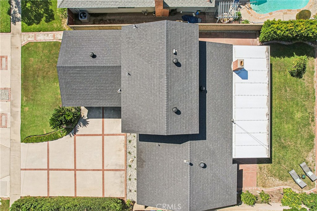 13541 Dean Street Tustin, CA 92780 - Photo 28 of 30 aerial view of a house with a yard and garage