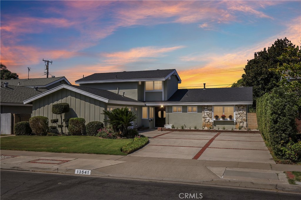 13541 Dean Street Tustin, CA 92780 - Photo 30 of 30 a front view of a house with a yard