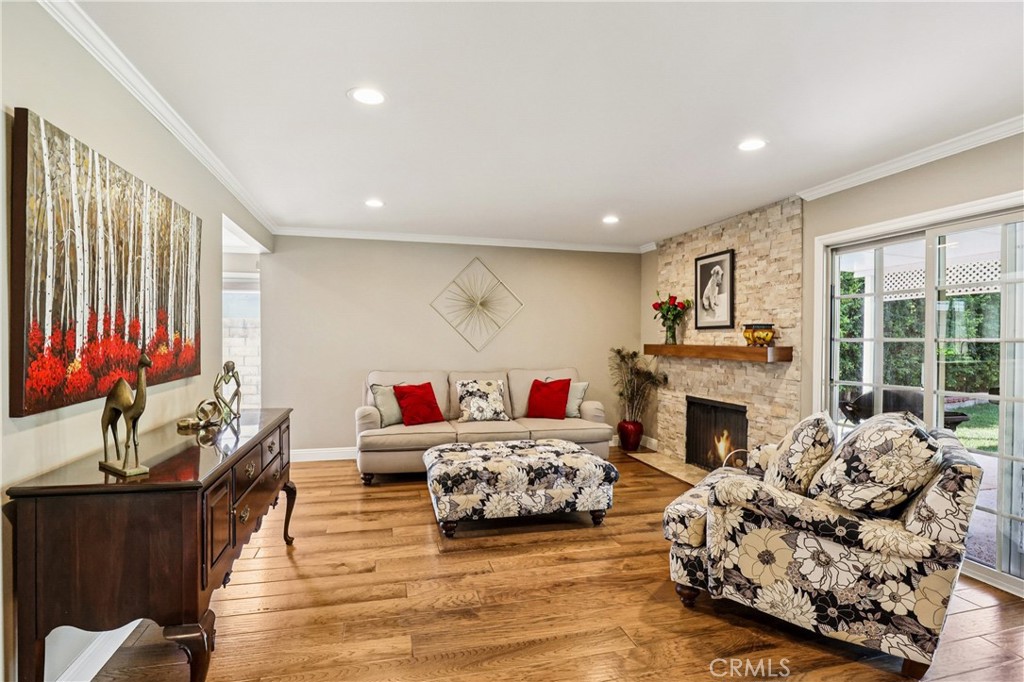 13541 Dean Street Tustin, CA 92780 - Photo 9 of 30 a living room with furniture fireplace and a large window