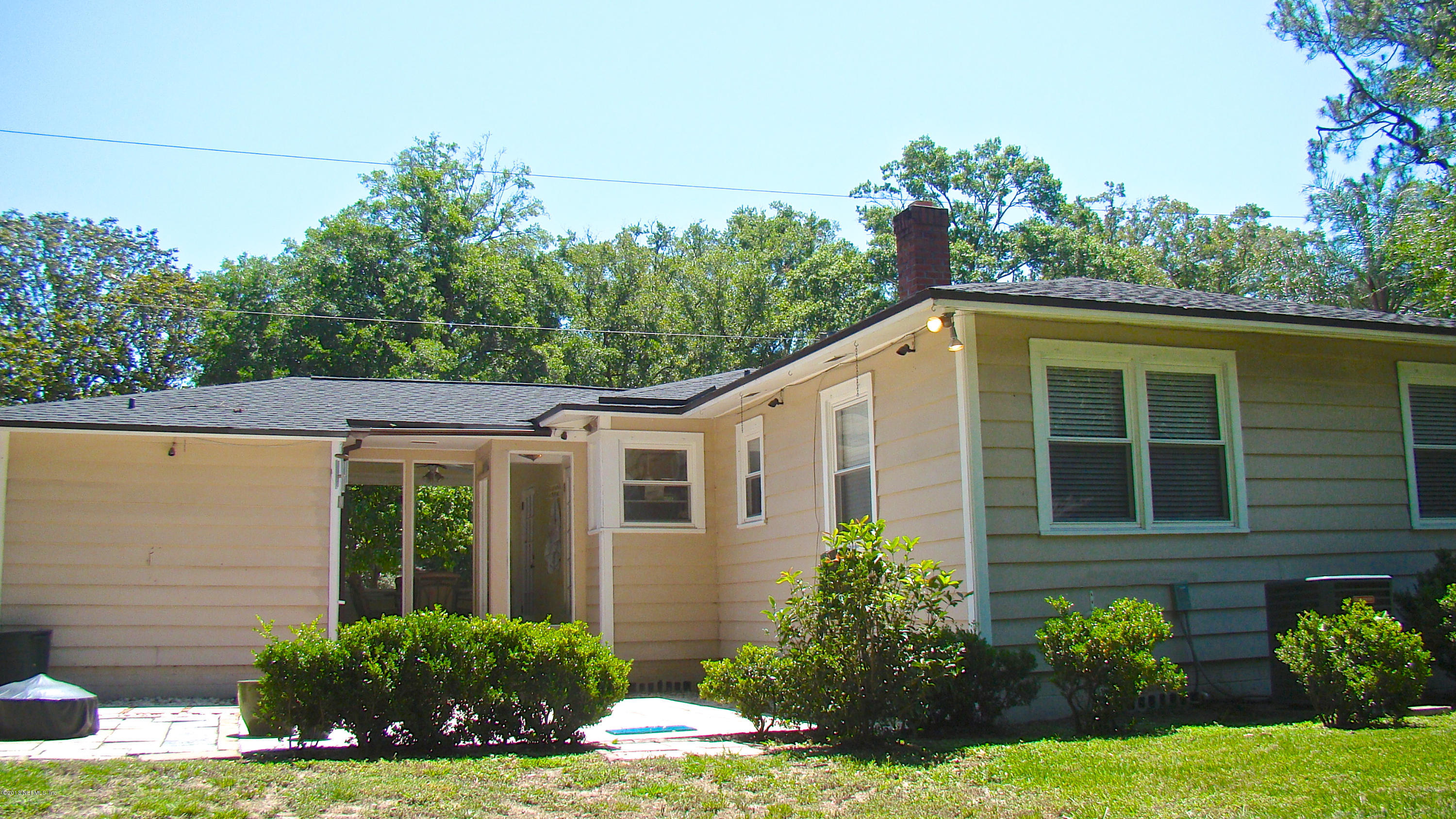 5504 Stetson Road Jacksonville, FL 32207 - Photo 12 of 15 a view of a house with a yard and potted plants