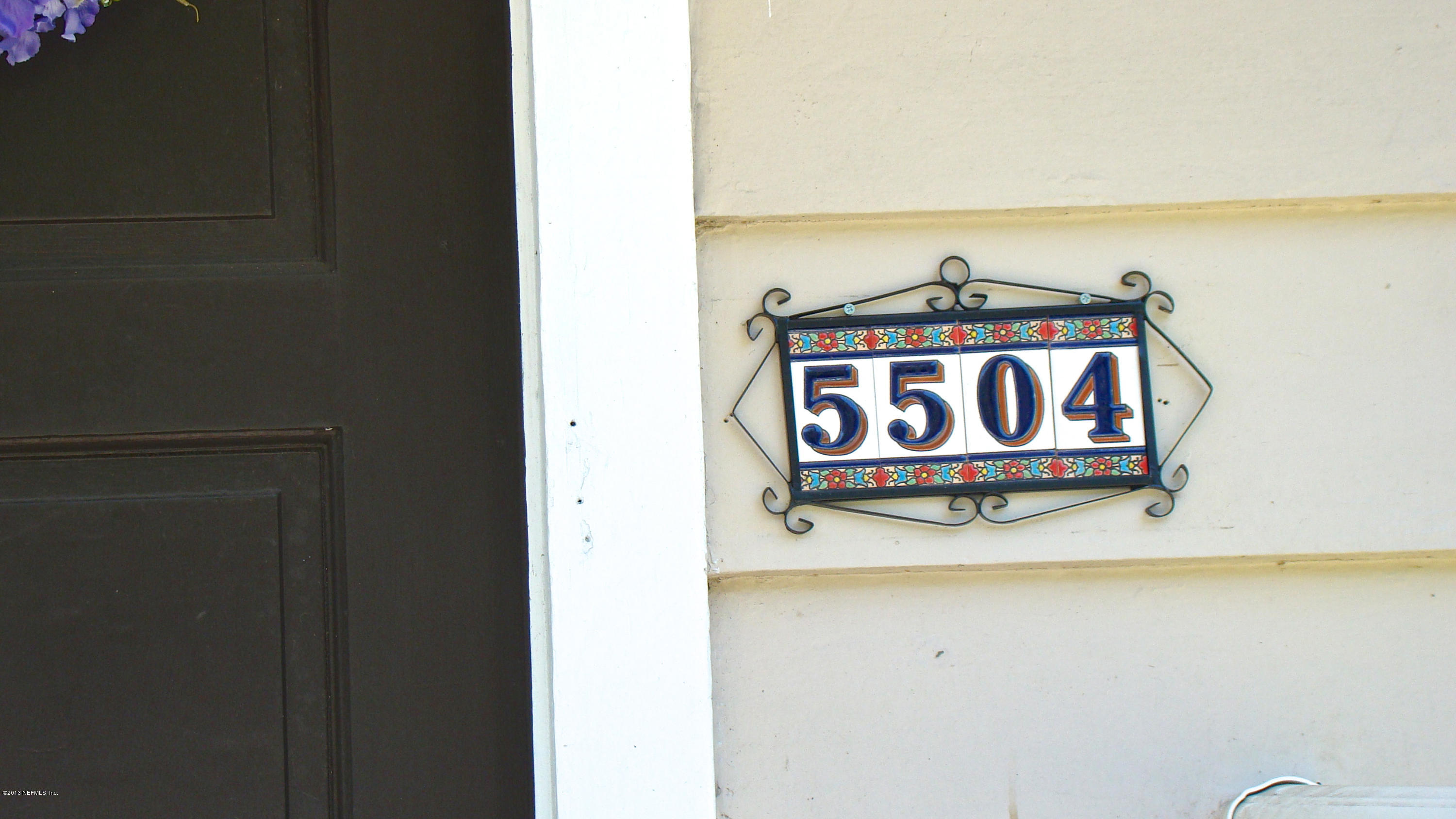 5504 Stetson Road Jacksonville, FL 32207 - Photo 2 of 15 a sign on a wall of a room