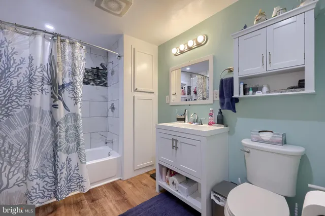 a bed room with a bed and a dresser