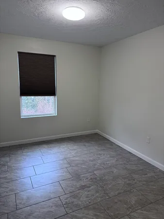 a view of a room that has a window in it