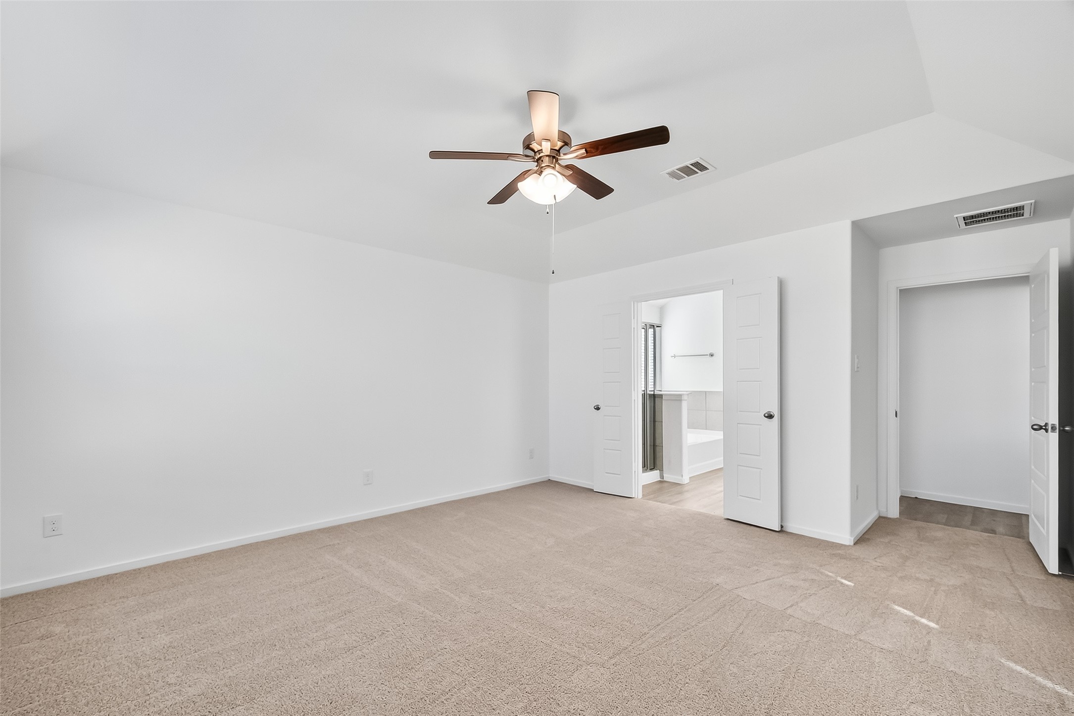 2115 Spring Hollow Drive Baytown, TX 77521 - Photo 15 of 36 an empty room with closet and windows