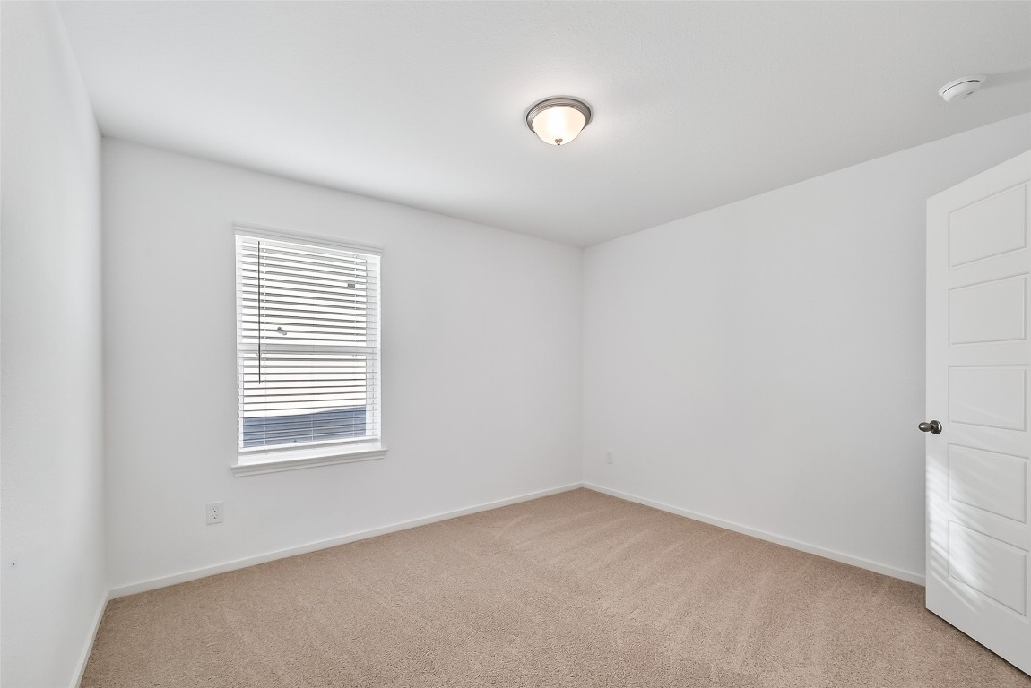 2115 Spring Hollow Drive Baytown, TX 77521 - Photo 27 of 36 an empty room with a window