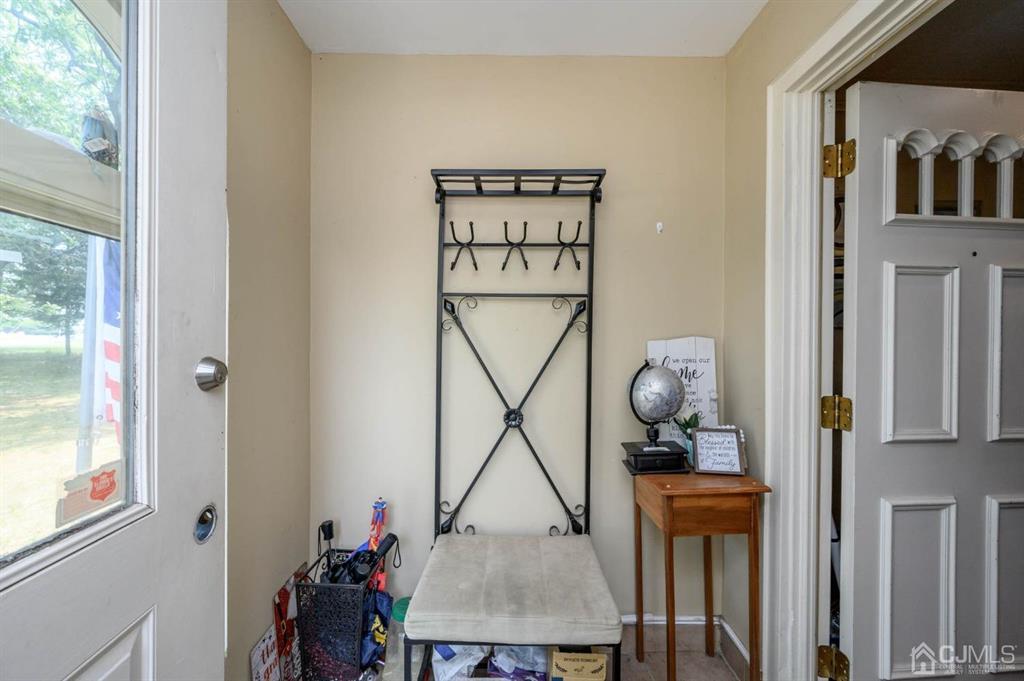 240 Lloyd Road Aberdeen, NJ 07747 - Photo 2 of 29 a view of an entryway with table and chair