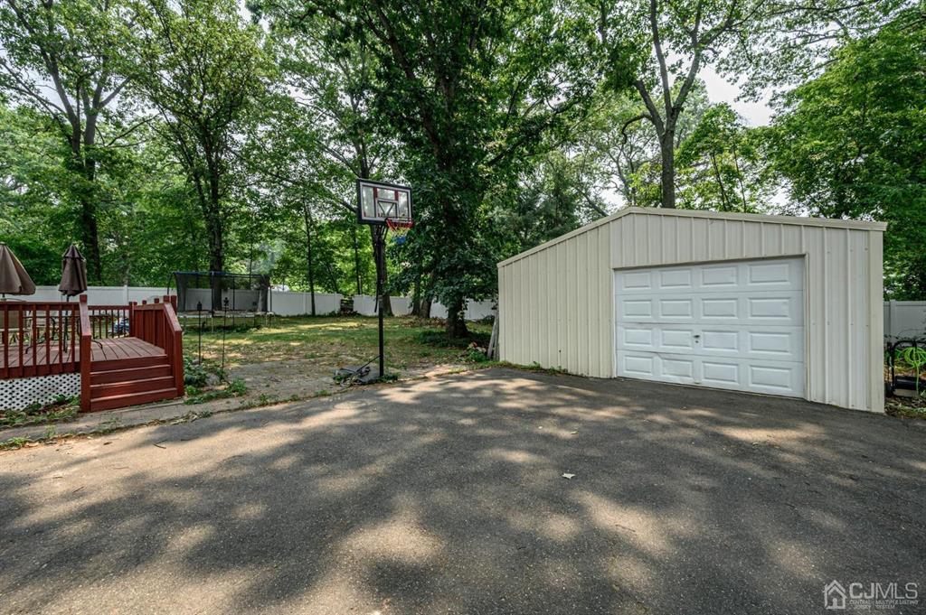 240 Lloyd Road Aberdeen, NJ 07747 - Photo 28 of 29 a view of backyard and tree